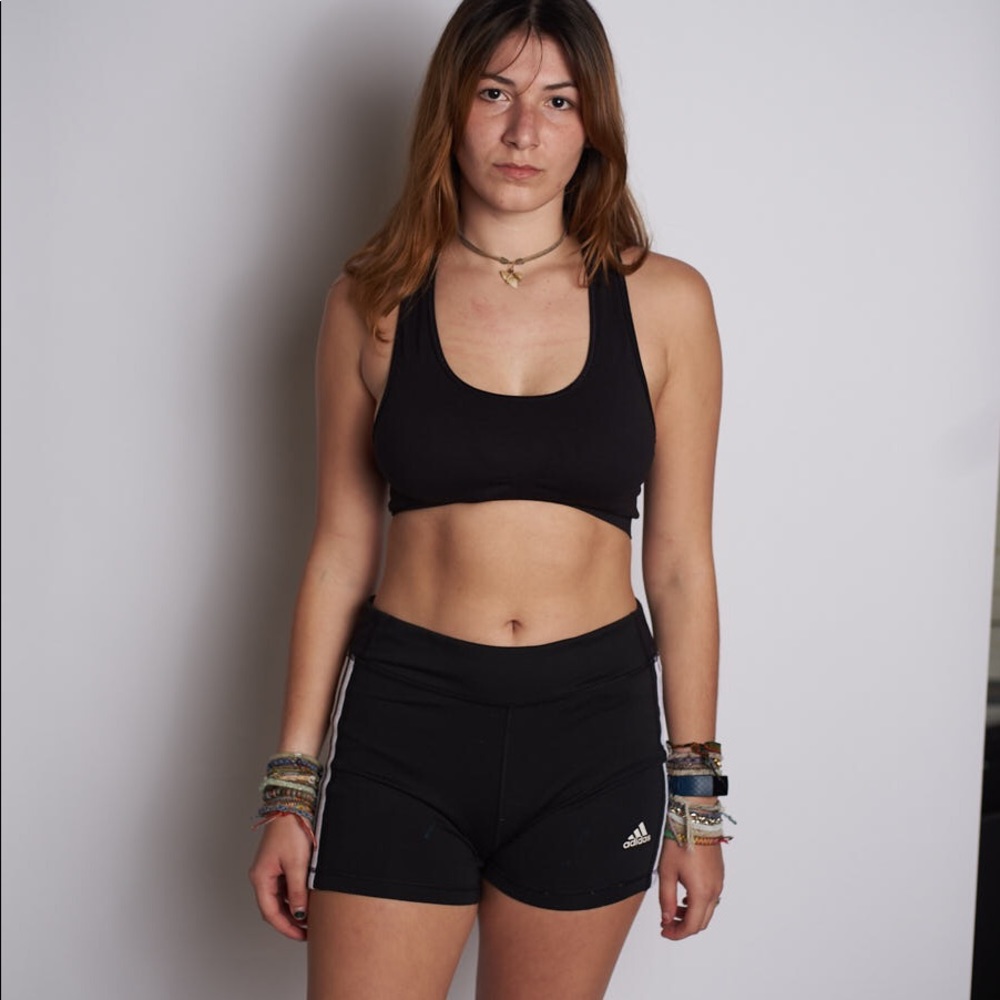 Black adidas workout shorts and black sports bra